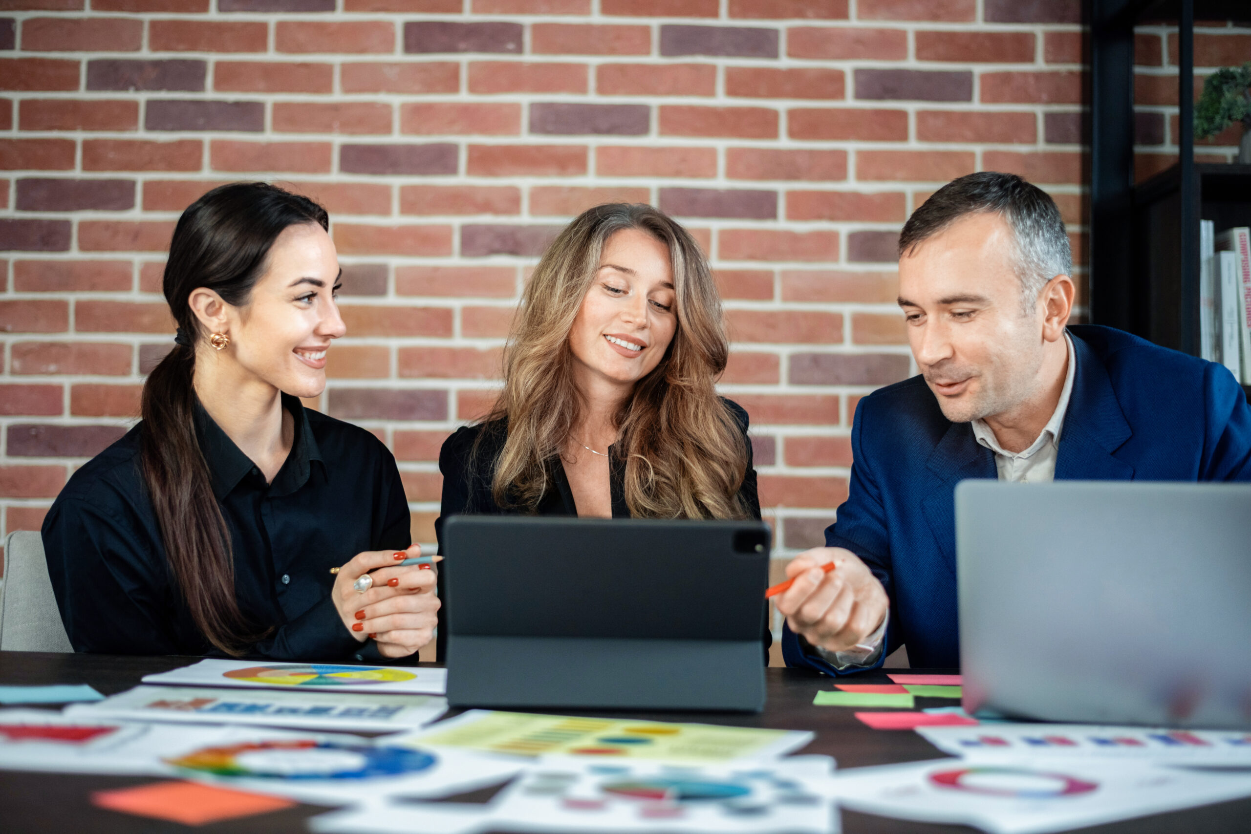 business session office women man discussing business affairs gadgets papers